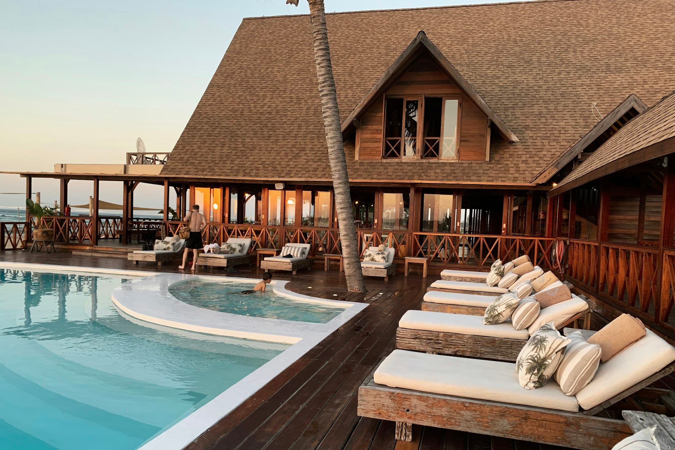 Hotel exterior and pool at sunset placeholder